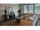 Inviting living room featuring a comfortable sofa, console table and decor, and scenic view through large windows at 316 Beachgrass Ln, Summerville, SC 29486