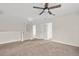 Loft area featuring neutral walls, plush carpeting, a ceiling fan and multiple doorways at 316 Beachgrass Ln, Summerville, SC 29486