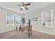 Well-lit home office with three windows providing natural light and featuring neutral walls and carpet at 316 Beachgrass Ln, Summerville, SC 29486