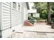 The backyard has a stone patio, brick steps, and neutral siding on the house at 317 Bay St, Walterboro, SC 29488