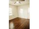 Bedroom featuring hardwood floors, white walls, and natural light at 317 Bay St, Walterboro, SC 29488