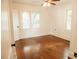 Light and bright bedroom with hardwood floors and ceiling fan at 317 Bay St, Walterboro, SC 29488