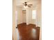 A bedroom featuring hardwood floors, natural light, and a ceiling fan at 317 Bay St, Walterboro, SC 29488