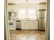 Bright kitchen with stainless steel appliances, white cabinets and butcher block countertops at 317 Bay St, Walterboro, SC 29488