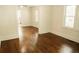 Living room with hardwood floors and doorway to kitchen at 317 Bay St, Walterboro, SC 29488
