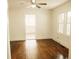 Light and bright living room with hardwood floors at 317 Bay St, Walterboro, SC 29488