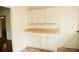 Pantry area with cabinets, butcher block countertop and wainscotting at 317 Bay St, Walterboro, SC 29488