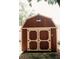 Close up of the barn style shed with double doors and cream trim at 317 Bay St, Walterboro, SC 29488