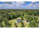 Aerial view of charming home on lush land with driveway and plenty of trees at 326 Turner Ln, Round O, SC 29474
