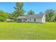 Spacious backyard with home, covered porch, and detached garage at 326 Turner Ln, Round O, SC 29474