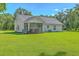 Expansive backyard featuring covered porch and manicured lawn at 326 Turner Ln, Round O, SC 29474