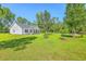 Landscaped front yard featuring a well-kept white home with black shutters at 326 Turner Ln, Round O, SC 29474