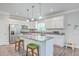 Modern kitchen features white cabinetry, granite countertops, stainless steel appliances, and a kitchen island at 326 Turner Ln, Round O, SC 29474