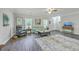 Well-lit living room presents stylish furniture, elegant decor, and a seamless transition to other living areas at 326 Turner Ln, Round O, SC 29474