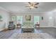 Comfortable living room with hardwood flooring, stylish decor, and windows with natural light at 326 Turner Ln, Round O, SC 29474