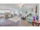 Open-concept living space features modern flooring, neutral walls, and seamless flow to dining and kitchen at 326 Turner Ln, Round O, SC 29474