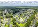 Beautiful aerial view of a residential community featuring many mature trees and community ponds at 3312 Telford Ct, Summerville, SC 29485