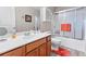 Bathroom with single sink vanity, framed mirror, white walls, and a shower and tub combo at 3312 Telford Ct, Summerville, SC 29485