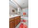 Bathroom with a single sink vanity, a framed mirror, white walls, and a shower and tub combo at 3312 Telford Ct, Summerville, SC 29485