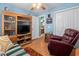 Bedroom with hardwood floors, built in shelving, adjacent bathroom, and seating area at 3312 Telford Ct, Summerville, SC 29485