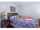 Bedroom with hardwood flooring, patterned bedspread, ceiling fan, and a side table at 3312 Telford Ct, Summerville, SC 29485