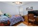 Bedroom with hardwood flooring, a work desk, a patterned bedspread, and a ceiling fan at 3312 Telford Ct, Summerville, SC 29485