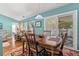 This dining room features a glass door leading to an outdoor area, enhancing the space with natural light and views at 3312 Telford Ct, Summerville, SC 29485
