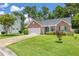Beautiful single-story brick home with a lush green lawn and mature trees at 3312 Telford Ct, Summerville, SC 29485
