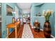 Bright and welcoming foyer with hardwood floors and decorative accents at 3312 Telford Ct, Summerville, SC 29485