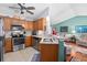 Open-concept kitchen featuring stainless appliances and granite countertops, seamlessly connecting to the living spaces at 3312 Telford Ct, Summerville, SC 29485
