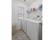 Bright laundry room featuring a washer and dryer, a window with blinds, and wire rack storage at 3312 Telford Ct, Summerville, SC 29485