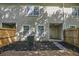 Backyard of townhome featuring a wooden deck, mulched garden area, and privacy fencing at 4028 Babbitt St, Charleston, SC 29414