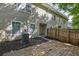 Rear of townhome featuring private wood deck and cozy outdoor living space at 4028 Babbitt St, Charleston, SC 29414