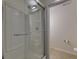 This bathroom features a shower with glass doors, toilet, and neutral-toned walls at 4028 Babbitt St, Charleston, SC 29414