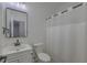 This bathroom features an enclosed tub and shower plus a pedestal sink at 4028 Babbitt St, Charleston, SC 29414