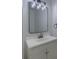 This bathroom features modern lighting and a vanity with a white countertop at 4028 Babbitt St, Charleston, SC 29414