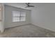 Bright bedroom featuring neutral carpet, a ceiling fan and a window with blinds at 4028 Babbitt St, Charleston, SC 29414