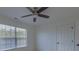 Bedroom featuring a ceiling fan, a window, and a closet at 4028 Babbitt St, Charleston, SC 29414