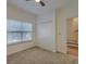 Bright bedroom features a ceiling fan, large window, and a spacious closet for ample storage at 4028 Babbitt St, Charleston, SC 29414