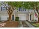 Charming townhome exterior with a private entrance and attached garage at 4028 Babbitt St, Charleston, SC 29414