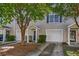 Exterior view of townhomes featuring garages and lawn space at 4028 Babbitt St, Charleston, SC 29414