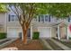 Charming townhome with a single-car garage, neat landscaping, and a welcoming front entrance at 4028 Babbitt St, Charleston, SC 29414