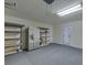 Spacious garage with ample storage space, shelving, and a refrigerator at 4028 Babbitt St, Charleston, SC 29414