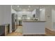 Modern kitchen with stainless steel appliances and white cabinetry at 4028 Babbitt St, Charleston, SC 29414