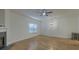 Bright living room with hardwood floors, a decorative fireplace, and a contemporary ceiling fan at 4028 Babbitt St, Charleston, SC 29414