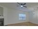 Bright living room features wood flooring, a fireplace, and a ceiling fan at 4028 Babbitt St, Charleston, SC 29414