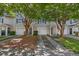 A well-maintained street view showcasing townhomes with driveways and mature trees at 4028 Babbitt St, Charleston, SC 29414