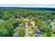The home is marked with a pin surrounded by lush greenery in the neighborhood aerial view at 405 Amberjack Way, Summerville, SC 29485