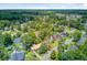 Birds-eye perspective of a peaceful neighborhood, with neatly arranged homes and tree-lined streets at 405 Amberjack Way, Summerville, SC 29485