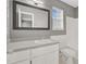 Bathroom featuring a large mirror, a white vanity, and a toilet and tub combination at 405 Amberjack Way, Summerville, SC 29485